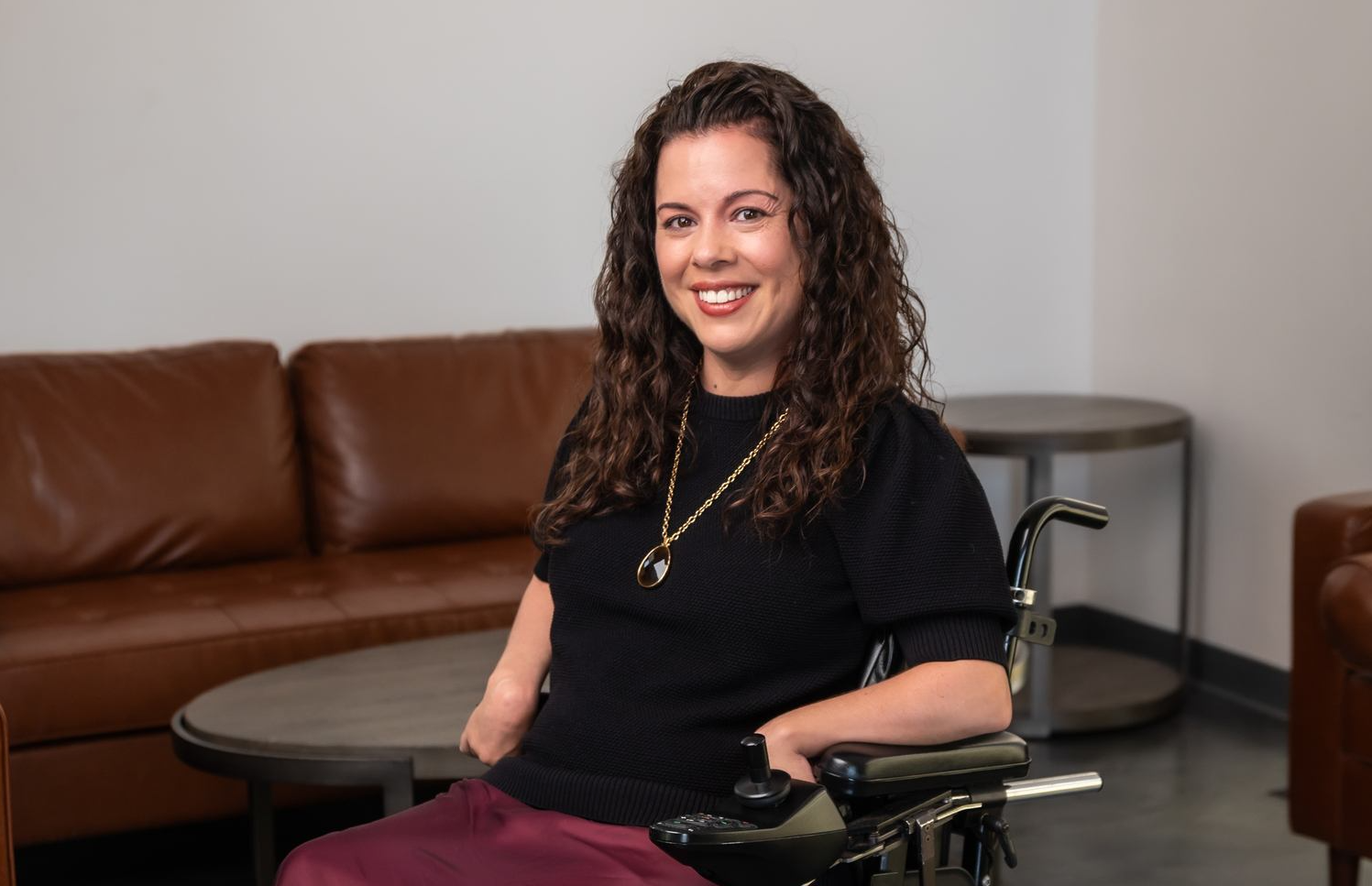 Portrait of Sarah Birdwell, a Bay Area accessibility advocate and wheelchair user featured in Hillendale’s disability home care story.